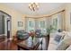 Inviting living room featuring a bay window and stylish furnishings at 3235 Munsey Ct, Cumming, GA 30041