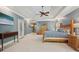 Expansive primary bedroom featuring sitting area, tray ceiling, and ensuite access at 3235 Munsey Ct, Cumming, GA 30041