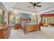 Spacious main bedroom featuring a tray ceiling, carpet flooring, and natural light at 3235 Munsey Ct, Cumming, GA 30041