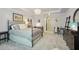 An elegant main bedroom featuring an iron bed frame, trey ceiling, and chandelier at 3235 Munsey Ct, Cumming, GA 30041
