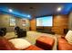 Cozy media room with large screen, comfortable seating, and ambient lighting at 3235 Munsey Ct, Cumming, GA 30041