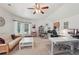 Bright and airy office featuring a ceiling fan, a couch, white desks, and lots of natural light at 3235 Munsey Ct, Cumming, GA 30041