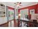 Bright office space with hardwood floors, built-in shelving, and natural light at 3235 Munsey Ct, Cumming, GA 30041