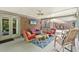 Screened-in porch featuring ceiling fan, brick accents, and comfortable seating area at 3235 Munsey Ct, Cumming, GA 30041
