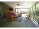 Relax on the outdoor porch with cozy seating, perfect for enjoying outdoor living with plenty of natural light at 3235 Munsey Ct, Cumming, GA 30041