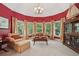 Bright sitting room with many windows, built-ins, and cozy seating at 3235 Munsey Ct, Cumming, GA 30041