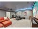 A cozy theater room features tiered seating with leather recliners and a large screen for immersive entertainment at 3235 Munsey Ct, Cumming, GA 30041