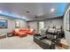 A comfortable home theater with leather seating, a large screen, and ambient lighting for a cinematic experience at 3235 Munsey Ct, Cumming, GA 30041