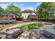 Aerial view showcases pool, multiple decks, screened porch and yard of lovely two story home with solar panels on roof at 5247 Hayden Farms Dr, Powder Springs, GA 30127