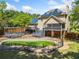 Aerial view shows pool, multiple decks, screened porch and yard of lovely two story home with solar panels on roof at 5247 Hayden Farms Dr, Powder Springs, GA 30127