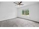 Bedroom featuring neutral decor and a view of the green outdoors at 5247 Hayden Farms Dr, Powder Springs, GA 30127