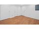 Large bonus room with neutral paint and wood laminate flooring ready for new owner's custom ideas at 5247 Hayden Farms Dr, Powder Springs, GA 30127