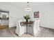 Spacious dining room featuring hardwood floors, and bright light coming from the kitchen at 5247 Hayden Farms Dr, Powder Springs, GA 30127