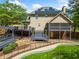 A view of a spacious house that offers an in-ground pool, multi-level decks, a screened porch and solar panels at 5247 Hayden Farms Dr, Powder Springs, GA 30127