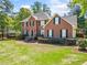 Charming brick home with manicured landscaping and a classic design, creating a welcoming curb appeal at 5247 Hayden Farms Dr, Powder Springs, GA 30127