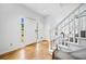 Bright foyer with hardwood floors, white trim and a staircase leading to the upper level at 5247 Hayden Farms Dr, Powder Springs, GA 30127