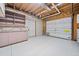 Large garage with storage, shelving, and automatic door ready for new owner's custom ideas at 5247 Hayden Farms Dr, Powder Springs, GA 30127