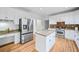 Bright kitchen with white cabinets, granite countertops, stainless steel appliances, and a center island at 5247 Hayden Farms Dr, Powder Springs, GA 30127