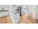 Open kitchen with white cabinets, granite countertops, stainless steel refrigerator and an adjacent dining area at 5247 Hayden Farms Dr, Powder Springs, GA 30127