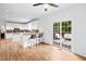 Kitchen with adjacent dining area, sliding glass doors lead to outdoor deck, hardwood flooring throughout at 5247 Hayden Farms Dr, Powder Springs, GA 30127
