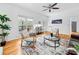 Bright living room with wood floors, neutral decor and a view of an outdoor deck at 5247 Hayden Farms Dr, Powder Springs, GA 30127