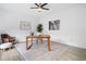 Bright office with neutral color palette, decorative art, and a modern ceiling fan at 5247 Hayden Farms Dr, Powder Springs, GA 30127