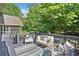 A spacious deck is furnished with comfortable seating, perfect for outdoor relaxation and enjoying the surrounding natural scenery at 5247 Hayden Farms Dr, Powder Springs, GA 30127
