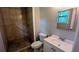 Tiled bathroom featuring a standup shower with a single-sink vanity at 1182 Demere Dr, Stone Mountain, GA 30083