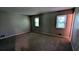 Carpeted bedroom with natural light, neutral paint, and a cozy atmosphere at 1182 Demere Dr, Stone Mountain, GA 30083