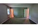 Comfortable carpeted bedroom with two windows and ample space at 1182 Demere Dr, Stone Mountain, GA 30083