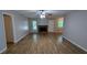 Spacious living room with light gray walls, wood-look floors, and a cozy brick fireplace at 1182 Demere Dr, Stone Mountain, GA 30083