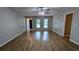 Bright, spacious living room with wood-look floors, neutral paint, and lots of windows at 1182 Demere Dr, Stone Mountain, GA 30083