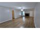 Bright living room features a decorative brick fireplace and stylish wood-look flooring throughout at 1182 Demere Dr, Stone Mountain, GA 30083