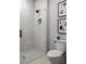 Modern bathroom with walk-in shower featuring a tiled shower and a sleek glass door at 1230 Mado Loop, Chattahoochee Hills, GA 30268