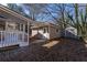Backyard view with covered deck and storage shed at 341 Little John Nw Dr, Lilburn, GA 30047