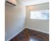 Bedroom with hardwood floors, window and view outside at 341 Little John Nw Dr, Lilburn, GA 30047