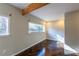 Bedroom with lots of natural light, wooden floors, structural beam and view outside at 341 Little John Nw Dr, Lilburn, GA 30047