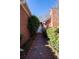 Charming brick home featuring a classic arched entryway and a well-maintained landscaped walkway at 341 Little John Nw Dr, Lilburn, GA 30047