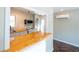 Kitchen view with stainless steel appliances, tile backsplash, and an open breakfast bar at 341 Little John Nw Dr, Lilburn, GA 30047