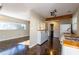Open concept kitchen with herringbone floors, wood beam, and modern appliances at 341 Little John Nw Dr, Lilburn, GA 30047