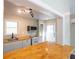 Kitchen view with stainless steel appliances, tile backsplash, and an open breakfast bar at 341 Little John Nw Dr, Lilburn, GA 30047