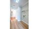 Bright laundry room with vinyl floors, storage shelf and washer/dryer hookups at 341 Little John Nw Dr, Lilburn, GA 30047