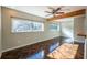 Bright living room featuring wood floors, beam, and windows with views at 341 Little John Nw Dr, Lilburn, GA 30047
