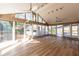 Bright sunroom with a vaulted ceiling, hardwood floors, and many large windows at 341 Little John Nw Dr, Lilburn, GA 30047