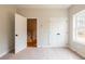 Inviting bedroom offers plush carpet and a view outside from the window allowing natural light at 4818 Floydwood Ln, Mableton, GA 30126