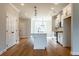 Open concept kitchen with island, stainless steel appliances and hardwood floors at 4818 Floydwood Ln, Mableton, GA 30126