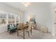 Well-lit office featuring a window, desk, chairs, decorative items, and a neutral color palette at 4818 Floydwood Ln, Mableton, GA 30126