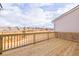 An empty back patio with a wooden fence overlooking a street and homes at 4818 Floydwood Ln, Mableton, GA 30126