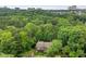 Scenic aerial view showcases the property nestled within lush green trees and cityscape backdrop at 1301 Cumberland Se Ct, Smyrna, GA 30080