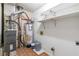 Utility room with water heater, HVAC system, and storage shelves at 1301 Cumberland Se Ct, Smyrna, GA 30080